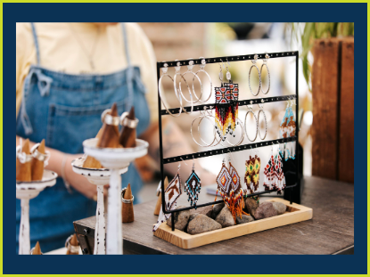 A woman examines an array of sparkling jewelry displayed in a showcase, showcasing her interest and curiosity.